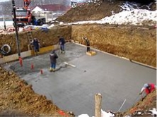 https://upload.wikimedia.org/wikipedia/commons/thumb/8/8a/Concrete_pouring.jpg/220px-Concrete_pouring.jpg